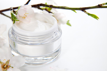 Face cream and almond flowers