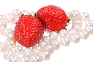 Fresh strawberry and pearl necklace isolated