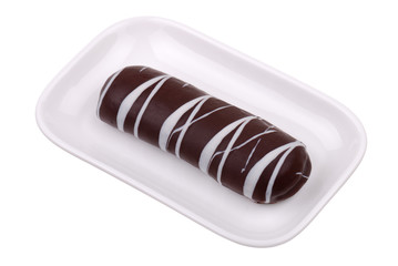 One chocolate cookies on a white plate