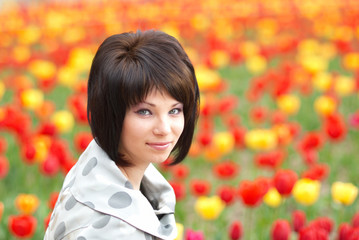 Naklejka premium Pretty girl with tulips