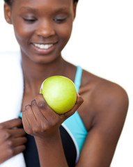 Fototapeta premium Close-up of a fitness woman eating an apple
