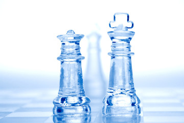 glass chess pieces with blue light
