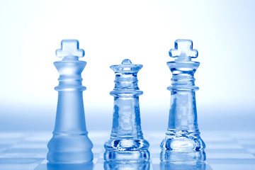 glass chess pieces with blue light