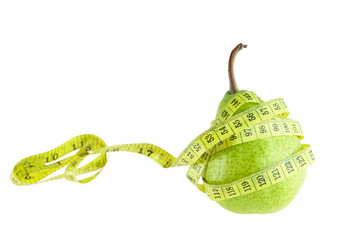 Ripe green pear with measuring tape