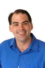 Obraz premium smiling happy man in blue shirt