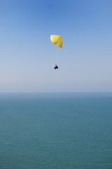Fototapeta na wymiar Double Paragliding above ocean