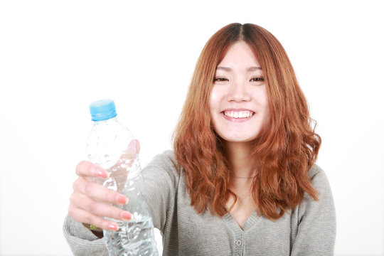 asian girl holding with bottle of water