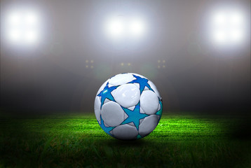 Fototapeta premium Soccer ball on the field of stadium with light
