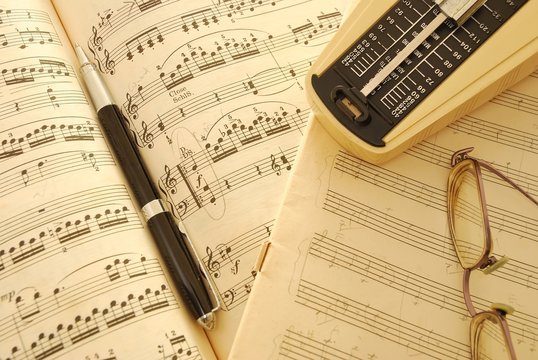 Old music score, manuscript and pen