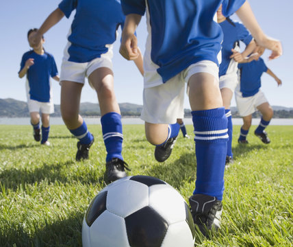 Asian children playing soccer