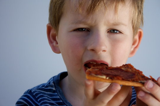 Boy Eating Pizza