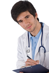 Fototapeta premium Male student doctor with stethoscope writing