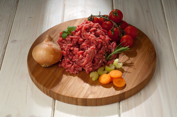 meat loaf with tomatoes and ingredients for italian ragu sauce