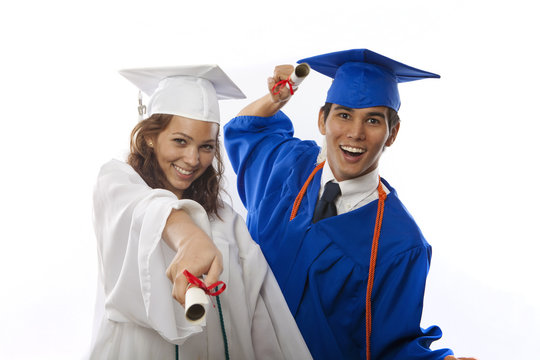 college graduates in cap and gown with diploma
