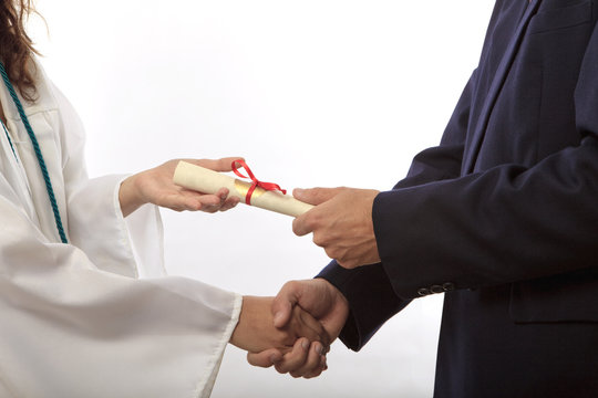 Graduate Receiving Her Diploma And A Handshake