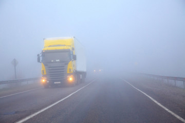 The truck on a line in a fog