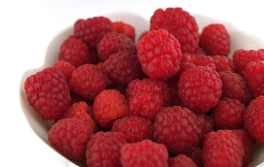 Raspberries Close Up in a Bowl on White