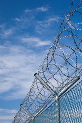 security fence with barbed wire