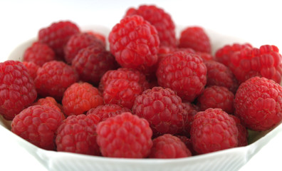 Raspberries Close Up in a Bowl on White