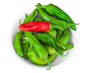 Chili peppers on white dish.