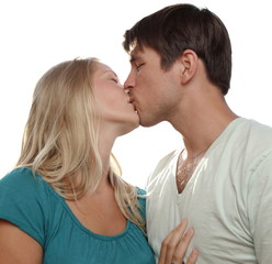 Obraz premium Young lovely couple kissing lovingly - isolated on white