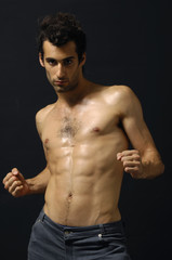 Fototapeta premium Sport and health body of young man. On black