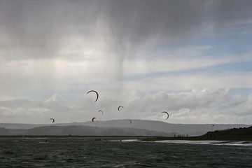 kitesurfers in stormy weather