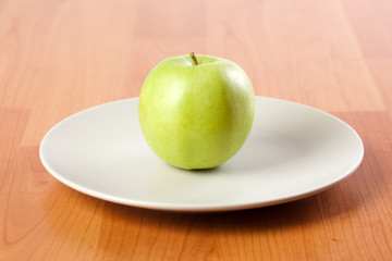 green apple on plate