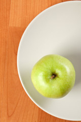 green apple on plate
