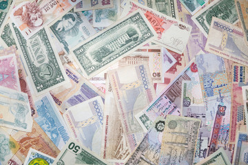 Background from banknotes of various monetary currencies