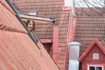 Girl and dormer window.