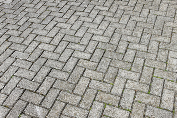 Gray paving cobblestone blocks pattern background.