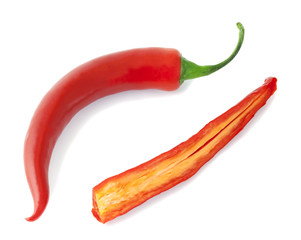 Naklejka premium Red peppers isolated on white background. One halved.