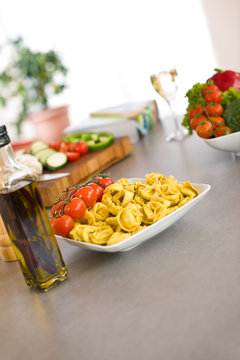 Cooking Italian food - pasta, tomato and olive oil