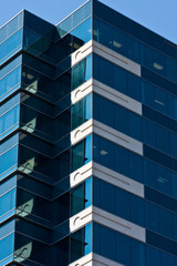 Blue Angled Glass Building with White Corners