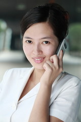 young asian business woman working with mobile phone