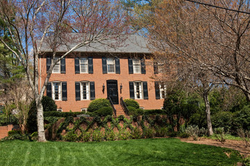 Obraz premium Traditional Brick Two Story on Freshly Mown Lawn