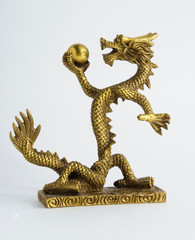 Golden Chinese Imperial Dragon with Pearl, isolated on white