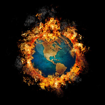Globe earth on hot fire flame
