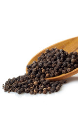 black pepper corns over the spoon