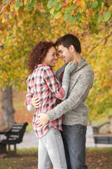 Romantic Teenage Couple In Autumn Park