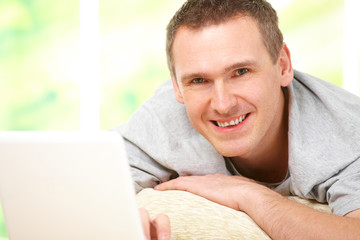 Man relaxing with laptop