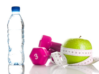 Dumbbells, apple, measure tape and bootle of water