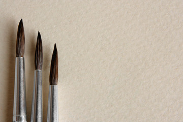 Paint brushes on papers background