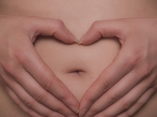 Hands heart stomach