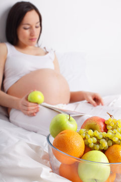 Pregnant woman with fruit