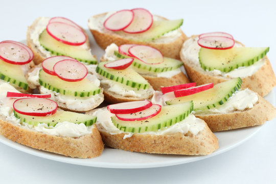 Appetizers with cream cheese, radish and cucumber