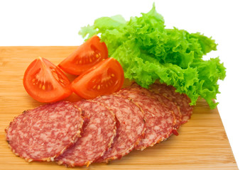 Slices of salami and tomatoes