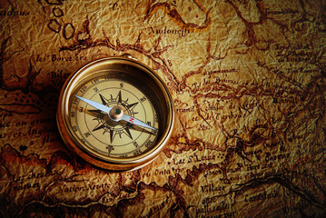 Fototapeta na wymiar Compass and a map