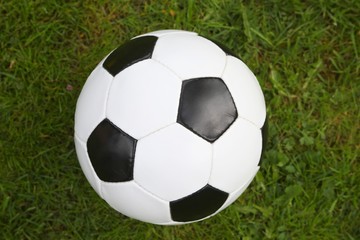 Fototapeta na wymiar soccer ball from above on grass